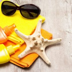 Towel sunscreen beach stock